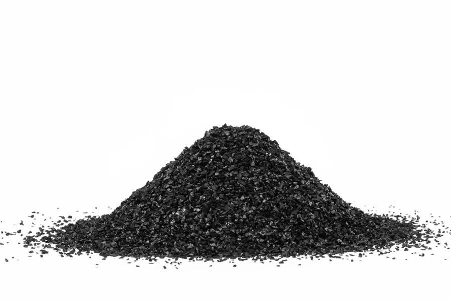 Pile of dark mined mineral granules
